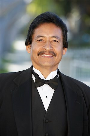 quinceanera - Portrait of man in tuxedo at Quinceanera Stock Photo - Premium Royalty-Free, Code: 693-06019467