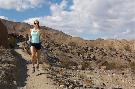 Young woman jogging in mountains Stock Photo - Premium Royalty-Free, Code: 693-06019501