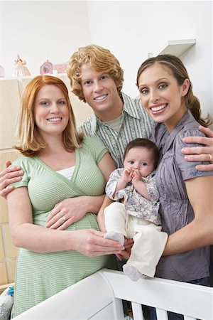 Portrait of two women, man and baby (1-6 months) in room Stock Photo - Premium Royalty-Free, Code: 693-06019567
