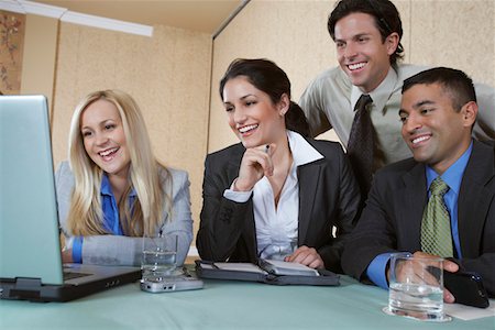 simsearch:693-03707355,k - Business colleagues using laptop at conference meeting Stock Photo - Premium Royalty-Free, Code: 693-06019605
