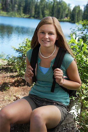 USA, Alaska, teenage girl wearing backpack at lake, portrait Stock Photo - Premium Royalty-Free, Code: 693-06019762