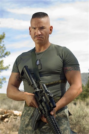 soldier (male) - Portrait of soldier with machine gun Stock Photo - Premium Royalty-Free, Code: 693-06019806