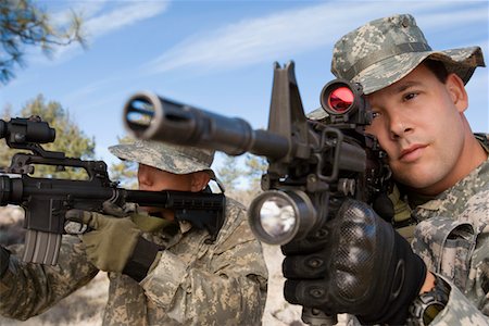 Soldiers aiming machine guns, close-up Stock Photo - Premium Royalty-Free, Code: 693-06019813