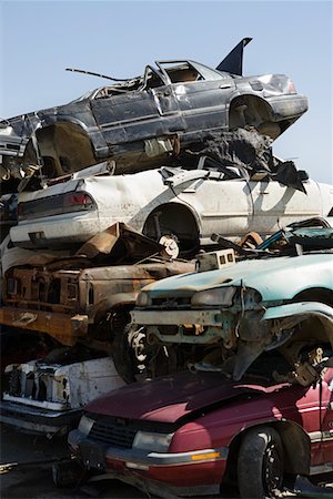 scrap yard pile of cars - Stacked cars in junkyard Stock Photo - Premium Royalty-Free, Code: 693-06019868