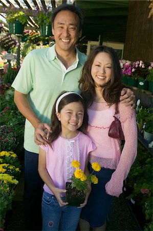 Family Shopping for Plants in nursery, portrait, front view Stock Photo - Premium Royalty-Free, Code: 693-06013507