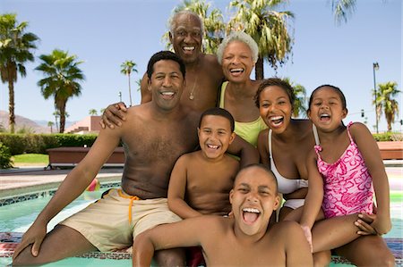 simsearch:693-03309308,k - Girl (5-6), boy (7-9), boy (10-12), with parents and grandparents at swimming pool, front view portrait. Stock Photo - Premium Royalty-Free, Code: 693-06013570