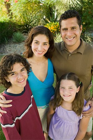simsearch:693-06013621,k - Girl (7-9) with brother (13-15) and parents outdoors, elevated view portrait. Stock Photo - Premium Royalty-Free, Code: 693-06013597