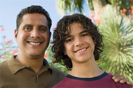 simsearch:693-06013621,k - Father with Arm Around Son (13-15), front view portrait. Stock Photo - Premium Royalty-Free, Code: 693-06013600