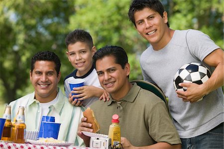 simsearch:693-06013621,k - Boy (13-15) with father and brothers at picnic. Stock Photo - Premium Royalty-Free, Code: 693-06013625