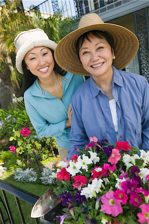 family backyard gardening not barbeque - Mother and daughter in garden, (portrait) Stock Photo - Premium Royalty-Free, Code: 693-06013667