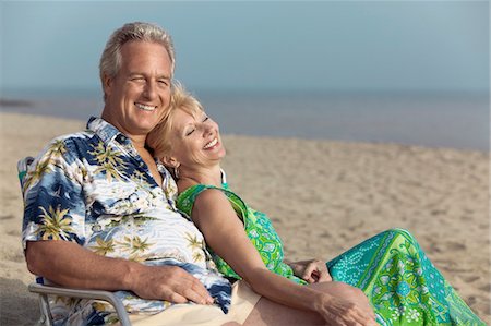 person in hawaiian shirt - Couple relaxing on beach Stock Photo - Premium Royalty-Free, Code: 693-06013732