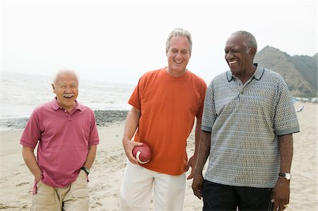 Three senior men walking on beach Stock Photo - Premium Royalty-Free, Code: 693-06013749