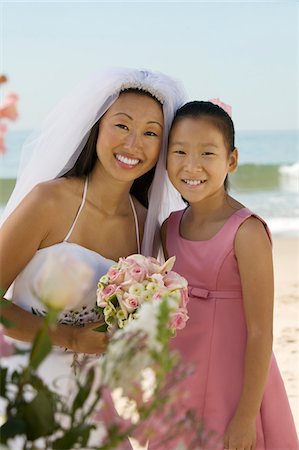 flower decoration in stage and marriage - Bride and sister on beach, (portrait) Stock Photo - Premium Royalty-Free, Code: 693-06013758