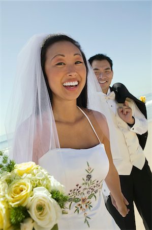 Bride and Groom on beach Stock Photo - Premium Royalty-Free, Code: 693-06013783