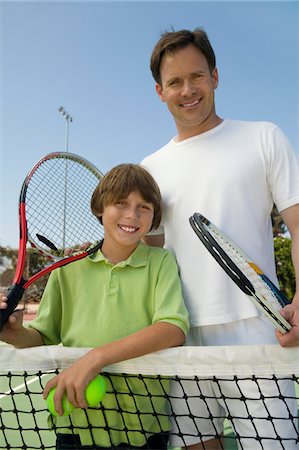 Father and Son at Tennis Net, portrait Stock Photo - Premium Royalty-Free, Code: 693-06013881