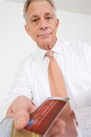 spending - Businessman Holding Credit Cards Stock Photo - Premium Royalty-Free, Code: 693-06020042