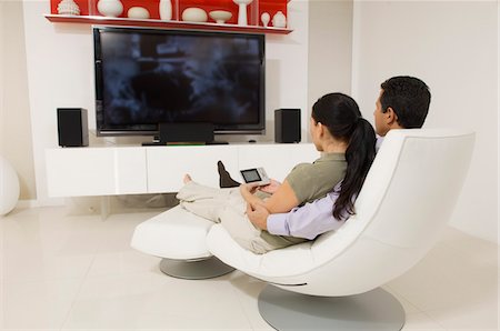 Couple Watching TV Foto de stock - Sin royalties Premium, Código: 693-06020088
