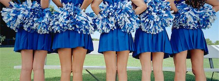 Five cheerleaders in row, back view, mid section Stock Photo - Premium Royalty-Free, Code: 693-06020092