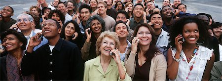 person speaking crowd - Crowd of people using mobile phones, outdoors Stock Photo - Premium Royalty-Free, Code: 693-06020124