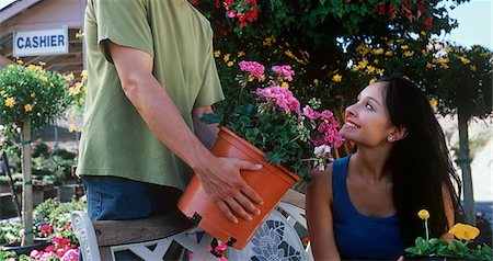 people shopping garden center model release property release - Man showing plant to woman in garden center Stock Photo - Premium Royalty-Free, Code: 693-06020129