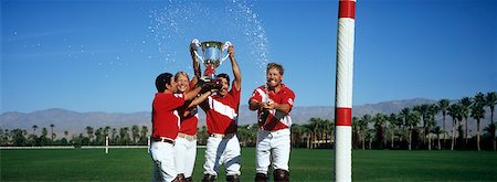 simsearch:693-06016661,k - Polo team celebrating with trophy on field Stock Photo - Premium Royalty-Free, Code: 693-06020140