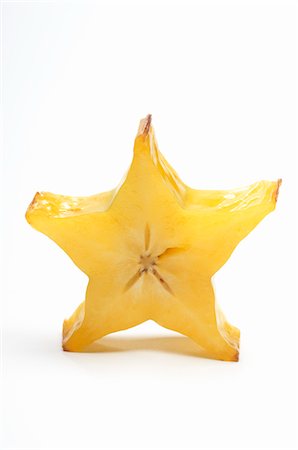 star (shape) - Starfruit on white background Foto de stock - Sin royalties Premium, Código: 693-06020223