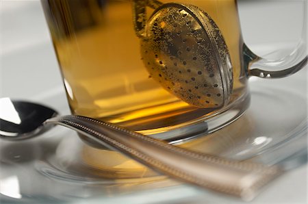 Glass with tea strainer inside, close-up Stock Photo - Premium Royalty-Free, Code: 693-06020287