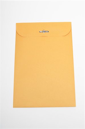 envelope (package) - Brown envelope on white background Stock Photo - Premium Royalty-Free, Code: 693-06020339