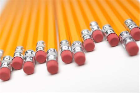 pencils and eraser - Row of yellow pencils, close-up of erasers Stock Photo - Premium Royalty-Free, Code: 693-06020347
