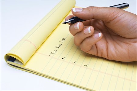 Woman writing list of tasks to do, close-up of hand Foto de stock - Sin royalties Premium, Código: 693-06020375