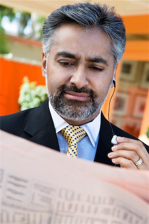 Businessman Reading a Newspaper Stock Photo - Premium Royalty-Free, Code: 693-06020406