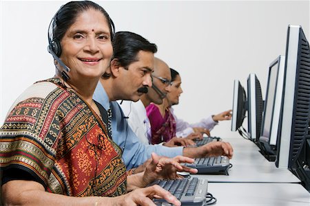 Customer Service Reps in Call Center Stock Photo - Premium Royalty-Free, Code: 693-06020438