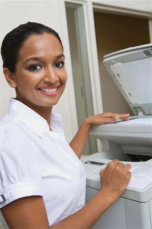 fax - Businesswoman Using Photocopier Fotografie stock - Premium Royalty-Free, Codice: 693-06020433