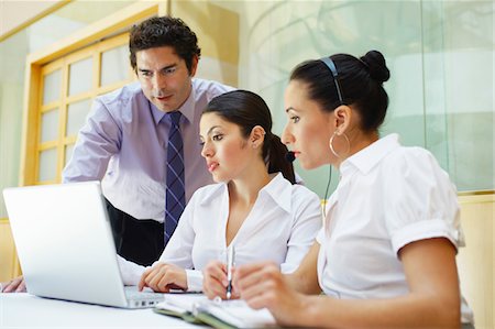 simsearch:693-03707355,k - Three business colleagues using laptop in office Stock Photo - Premium Royalty-Free, Code: 693-06020496