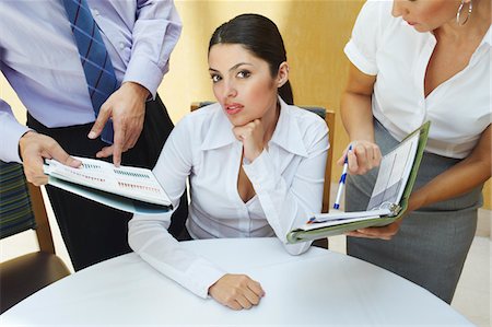 simsearch:693-03707355,k - Business woman working with colleagues in office Stock Photo - Premium Royalty-Free, Code: 693-06020497