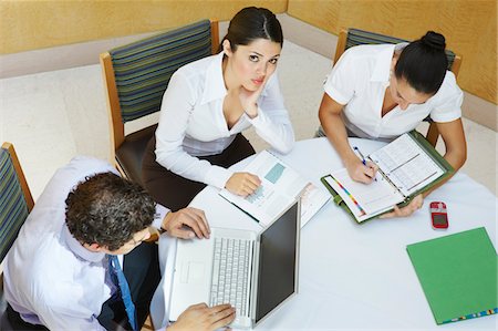 simsearch:693-06019591,k - Three business colleagues working in office Stock Photo - Premium Royalty-Free, Code: 693-06020499