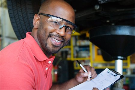 portrait guy in his garage - Auto Mechanic Stock Photo - Premium Royalty-Free, Code: 693-06020545