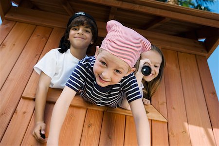 Kids Playing in Playhouse Stock Photo - Premium Royalty-Free, Code: 693-06020578