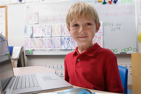 Schoolboy Using a Laptop Stock Photo - Premium Royalty-Free, Code: 693-06020629