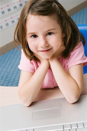 education and back to school - Little Girl Using a Laptop Stock Photo - Premium Royalty-Free, Code: 693-06020650