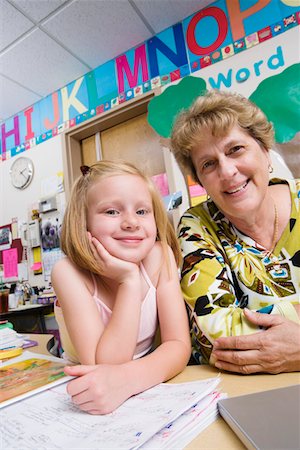 student portrait teacher not smiling - Teacher and Elementary Student Stock Photo - Premium Royalty-Free, Code: 693-06020732