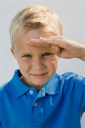 saluting someone - Young Boy Saluting Foto de stock - Sin royalties Premium, Código: 693-06020784