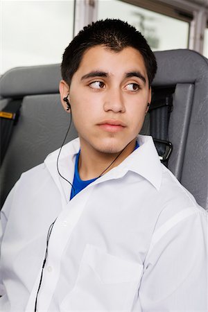 Teenage Boy Listening to MP3 Player on Bus Stock Photo - Premium Royalty-Free, Code: 693-06020825