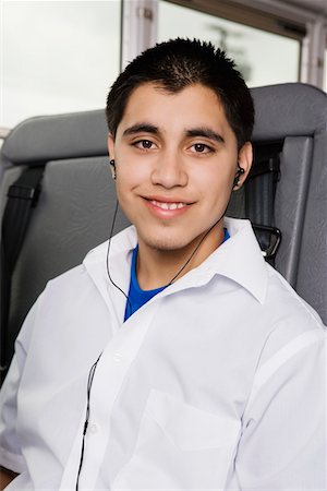 Teenage Boy Listening to MP3 Player on Bus Stock Photo - Premium Royalty-Free, Code: 693-06020826