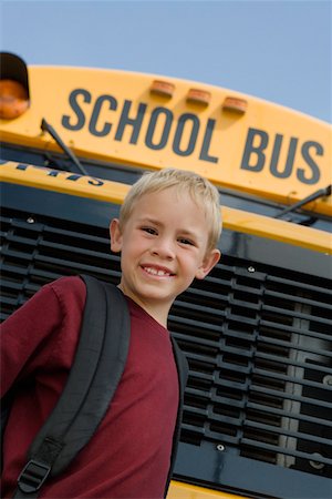 simsearch:693-06020835,k - Elementary Student Standing by School Bus Stock Photo - Premium Royalty-Free, Code: 693-06020872