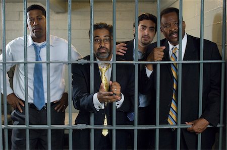 prisoners - Four people in prison cell Stock Photo - Premium Royalty-Free, Code: 693-06020910