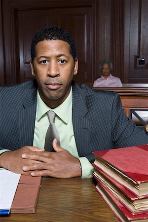 defense lawyer - Man sitting in court, portrait Stock Photo - Premium Royalty-Free, Code: 693-06020955