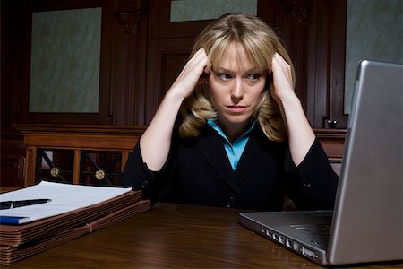 Woman using laptop in court Stock Photo - Premium Royalty-Free, Code: 693-06020968