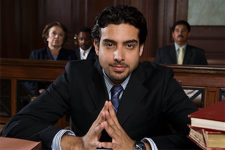 defense lawyer - Man sitting in court, portrait Stock Photo - Premium Royalty-Free, Code: 693-06020976