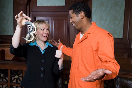 prisonier - Lawyer and client celebrating in court Stock Photo - Premium Royalty-Free, Code: 693-06020998